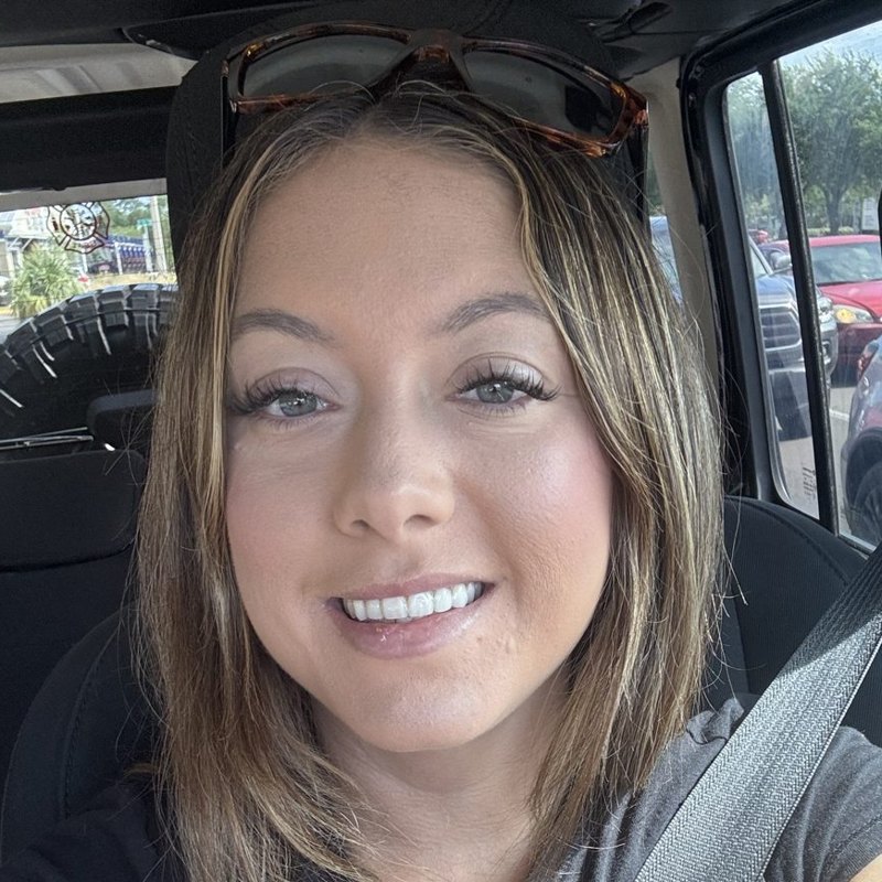 Portrait of the owner of The Beauty Space, smiling, with a fresh lash lift