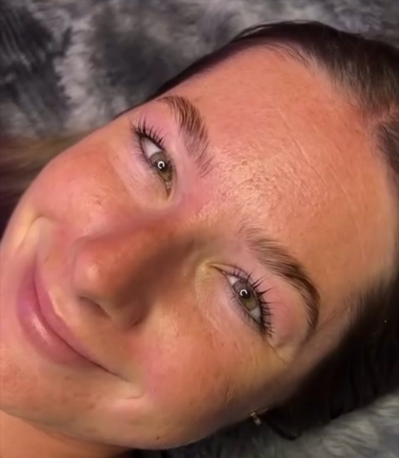 Client smiling after a brow lamination and lash lift combo